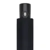 A close-up view of the handle of a black umbrella. Produktbild-Vorschau