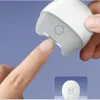 A close-up shot of a person's finger being trimmed by an electric nail trimmer, with a smaller image of the product at the bottom. Voir les images du produit