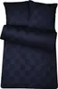 A neatly folded duvet cover and two pillowcases with a subtle checkered pattern, laid out on a white background.