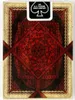 The back of a deck of playing cards with intricate red and black design. Produktbild-Vorschau