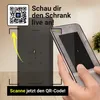 A person is holding a smartphone in front of a tall black cabinet. The image is promoting an augmented reality (AR) experience to view the cabinet live. Voir les images du produit
