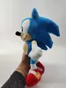 A hand holding a Sonic The Hedgehog plush toy against a white background. Produktbild-Vorschau