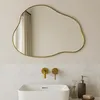 A bathroom sink area with a mirror, faucets, and soap dispenser. Náhľad obrázku produktu