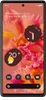A smartphone displaying widgets and app icons on its screen, set against a floral wallpaper. Náhled obrázku produktu