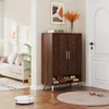 A hallway or entryway scene with a shoe cabinet, sofa, and artwork. Náhľad obrázku produktu