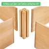 Wooden planks and a central wooden connector piece, suggesting assembly of a raised garden bed. Produktbild-Vorschau