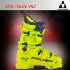 A bright yellow ski boot with black and blue accents, set against a dark background with red light effects. Voir les images du produit