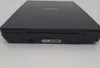The bottom edge of a black Canon flatbed scanner is shown against a white background. A serial number label is visible. Produktbild-Vorschau
