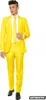 A man wearing a bright yellow suit, white shirt, and yellow tie, standing against a white background. Produktbild-Vorschau