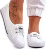 A close-up shot of a person's feet wearing white Lee Cooper sneakers. Podgląd zdjęcia produktu