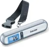 A silver digital luggage scale with a black strap and buckle is shown against a white background. Anteprima dell’immagine prodotto