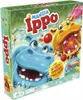 The image shows the packaging of a board game called 'Mangia Ippo'. The box features cartoon hippos in water, with red balls scattered around. Podgląd zdjęcia produktu