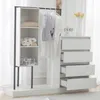 A white wardrobe set with a hanging rod and drawers, set against a light background with sheer curtains. Anteprima dell’immagine prodotto