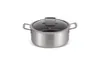 A stainless steel pot with a glass lid is shown against a white background. Podgląd zdjęcia produktu