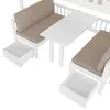 A close-up view of a white wooden children's bed with integrated seating and a table, showing open drawers. Voir les images du produit