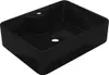 A black rectangular sink with two holes, one for a faucet and one for a drain, shown from a diagonal angle. Náhled obrázku produktu