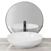 A white oval countertop sink with a black faucet is shown in front of a round mirror. Náhled obrázku produktu