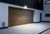 A modern garage door and driveway at dusk. Anteprima dell’immagine prodotto