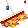 A broom is shown sweeping a pile of colorful autumn leaves. Náhled obrázku produktu
