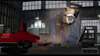 A Lego T-Rex breaks out of a glass enclosure in a warehouse, with a red Lego car nearby. Produktbild-Vorschau