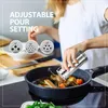 A person is using a spice grinder over a pan of food. Produktbild-Vorschau
