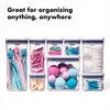 A collection of clear plastic storage containers filled with various bathroom and cosmetic items. Anteprima dell’immagine prodotto