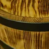 A close-up view of a wooden barrel with metal bands. Náhled obrázku produktu