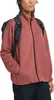 A woman wearing a pink jacket and a backpack. Produktbild-Vorschau