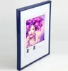 A framed picture of a woman with purple hair and butterflies. Produktbild-Vorschau