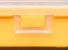 A close-up shot of the latch mechanism on a yellow storage box. Produktbild-Vorschau