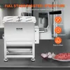 A stainless steel meat mixer is shown on a countertop with some ingredients and a plate of ground meat. Náhľad obrázku produktu