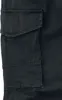 A close-up view of the cargo pockets on a pair of black cargo pants. Produktbild-Vorschau
