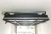 A roof box lift system mounted to a ceiling, with the roof box itself suspended underneath. Produktbild-Vorschau
