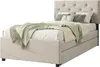 A beige upholstered bed with a tufted headboard and several pillows and a green throw blanket. Anteprima dell’immagine prodotto