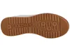The sole of a white sneaker with a brown rubber sole. Produktbild-Vorschau