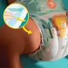 A close-up of a baby's leg with a Pampers diaper on, highlighting a feature with a diagram. Náhled obrázku produktu