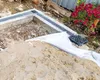 A construction site with drainage grates and sand. Produktbild-Vorschau