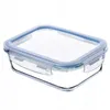 A clear glass food storage container with a blue lid, isolated on a white background. Produktbild-Vorschau