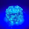 A coiled string of blue LED lights on a blue background. Produktbild-Vorschau