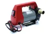 A product shot of a 12V oil pump with a red plastic handle and gray housing, set against a white background. Náhled obrázku produktu