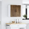 A wall-mounted kitchen cabinet with two doors is shown against a white wall, with a window and blinds in the background. Below the cabinet, a small white table with a wooden top holds a bowl, a pitcher, and a mug. Anteprima dell’immagine prodotto