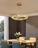 A dining room with a table, chairs, and a chandelier. Anteprima dell’immagine prodotto