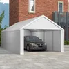 A white carport with a car inside, parked in front of a brick building. Produktbild-Vorschau