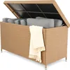 An open storage box with cushions inside, a blanket draped over the side. Produktbild-Vorschau
