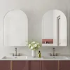 A modern bathroom vanity with two sinks and arched mirrors. Anteprima dell’immagine prodotto