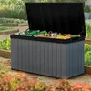 A garden storage box filled with gardening tools and supplies, placed outdoors in a garden setting. Voir les images du produit