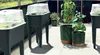A balcony or patio with several raised garden beds and potted plants. Produktbild-Vorschau