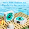 Two retro-style record players with glowing green turntables are placed on a wooden table by the water. Produktbild-Vorschau