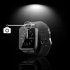 A smartwatch is shown against a black background with a spotlight effect from above. A graphic overlay indicates a camera feature. Produktbild-Vorschau