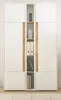 A white and wood-tone cabinet with shelves and storage compartments. Produktbild-Vorschau